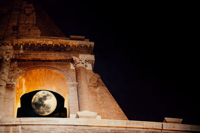 Low angle view of historical building against sky at night