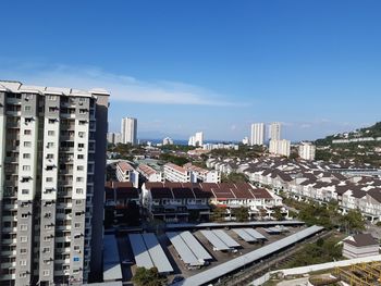 High angle view of buildings in city against sky