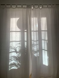 Shadow of curtain on window