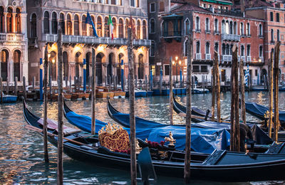 Boats moored in canal