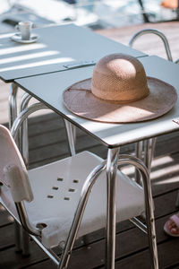 High angle view of hat on table at cafe