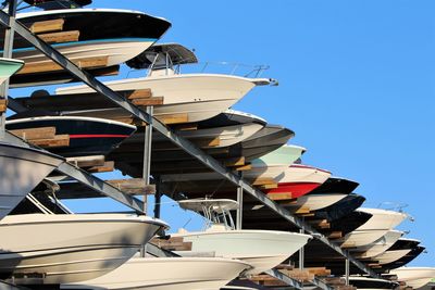 Row of boats on a boat storage rack in a marina. maritime storage boat yard