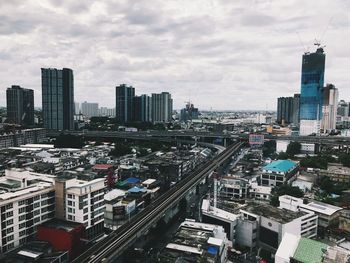 High angle view of buildings in city against sky