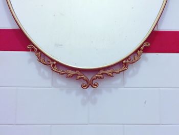 Cropped image of bathroom mirror