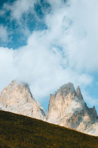 Scenic view of mountain against cloudy sky
