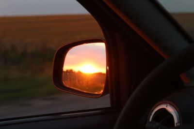 Reflection of sky on side-view mirror