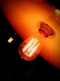 Low angle view of illuminated lamp
