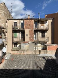 Residential buildings against sky in city