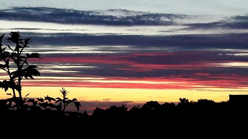 Scenic view of silhouette landscape against sky during sunset