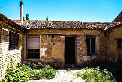 Exterior of old building against clear sky