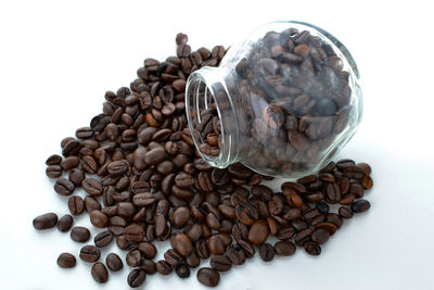 Close-up of coffee beans against white background