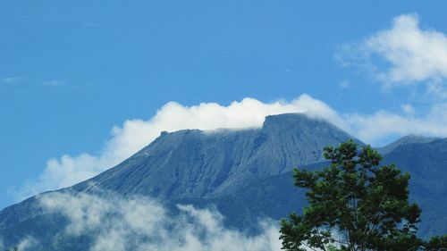 Low angle view of volcanic mountain against sky