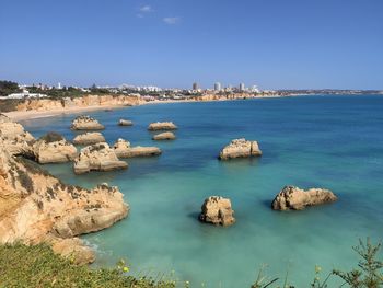 Panoramic view of sea and rocks against sky