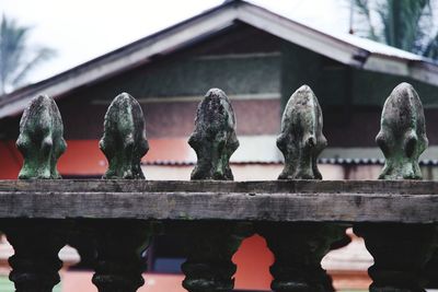 Close-up of statue against building