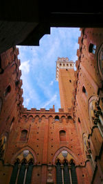 Low angle view of building against blue sky