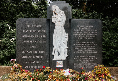 Statue of people on cemetery