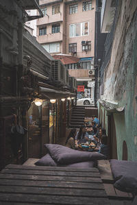 People sitting outside building