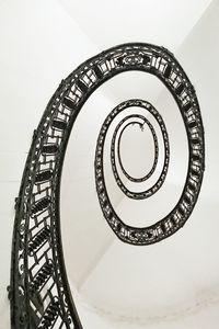 Low angle view of spiral staircase in building