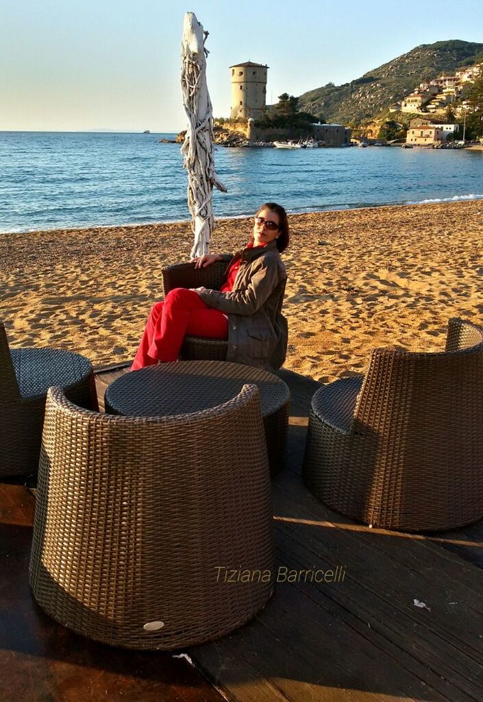 WOMAN SITTING ON BENCH