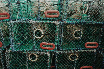 Full frame shot of stacked lobster traps at harbor