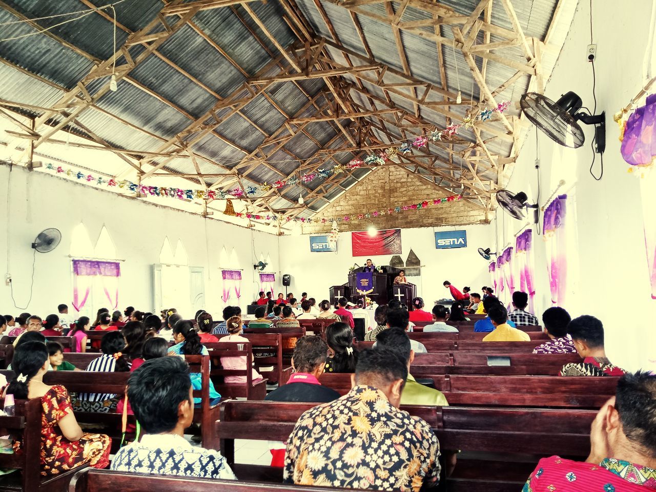 crowd, group of people, large group of people, indoors, women, adult, men, sitting, architecture