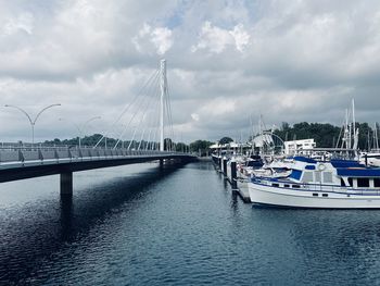 View of marina bay bridge against cloudy sky