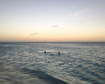 Scenic view of calm sea at sunset