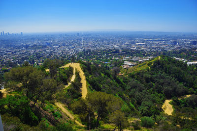 Aerial view of cityscape against sky