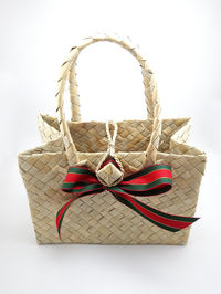 Close-up of wicker basket on white background