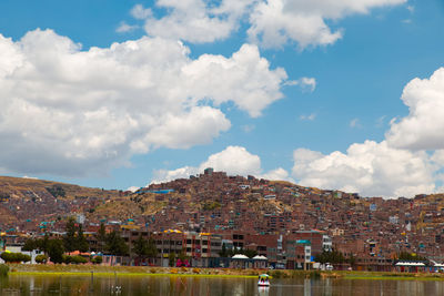 Buildings in city against sky