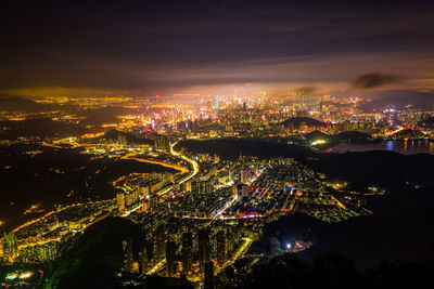 High angle view of illuminated buildings in city at night