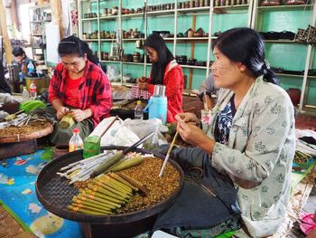 Young woman preparing food in basket