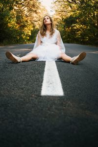 Portrait of woman on road