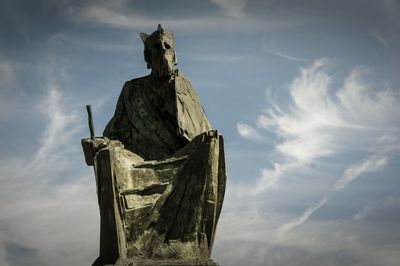 Low angle view of statue against sky