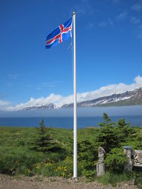 View of mountain range against blue sky