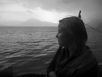 Young woman looking at view from boat in lake