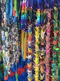 Multi colored decorations hanging at market