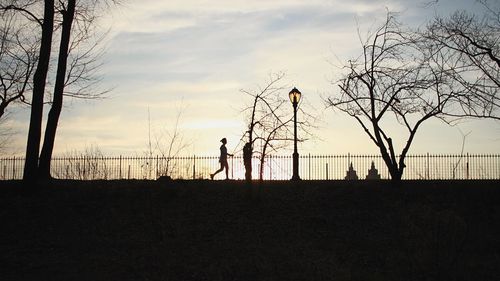 Silhouette of people at sunset