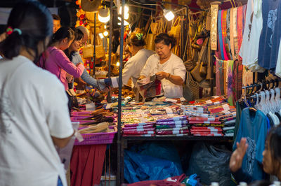 People at market stall