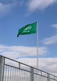 Low angle view of flag against sky