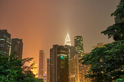 Illuminated buildings in city at night