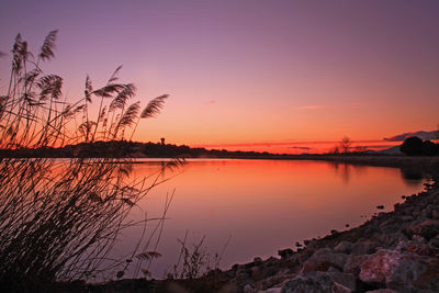 Scenic view of lake during sunset