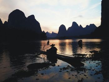 Scenic view of lake at sunset