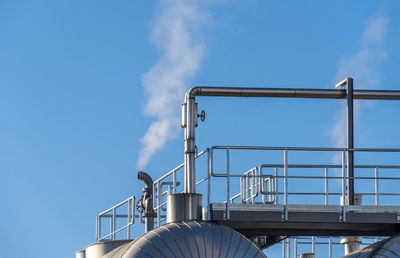 Low angle view of factory against sky