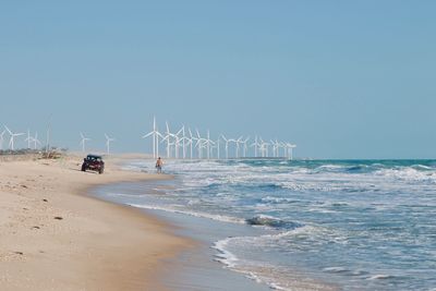 Scenic view of beach against clear sky