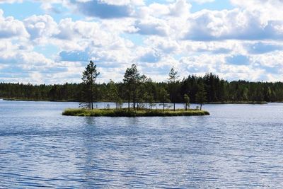 Scenic view of lake against cloudy sky