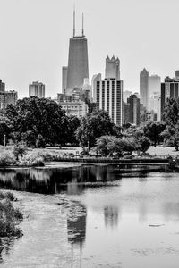 View of skyscrapers in city against clear sky