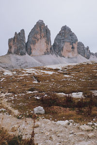 Rock formations on landscape against clear sky