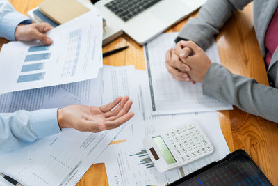 Midsection of business colleagues working at office