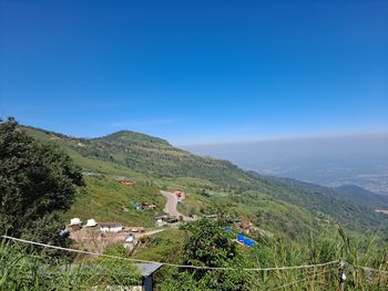 Scenic view of mountains against clear blue sky